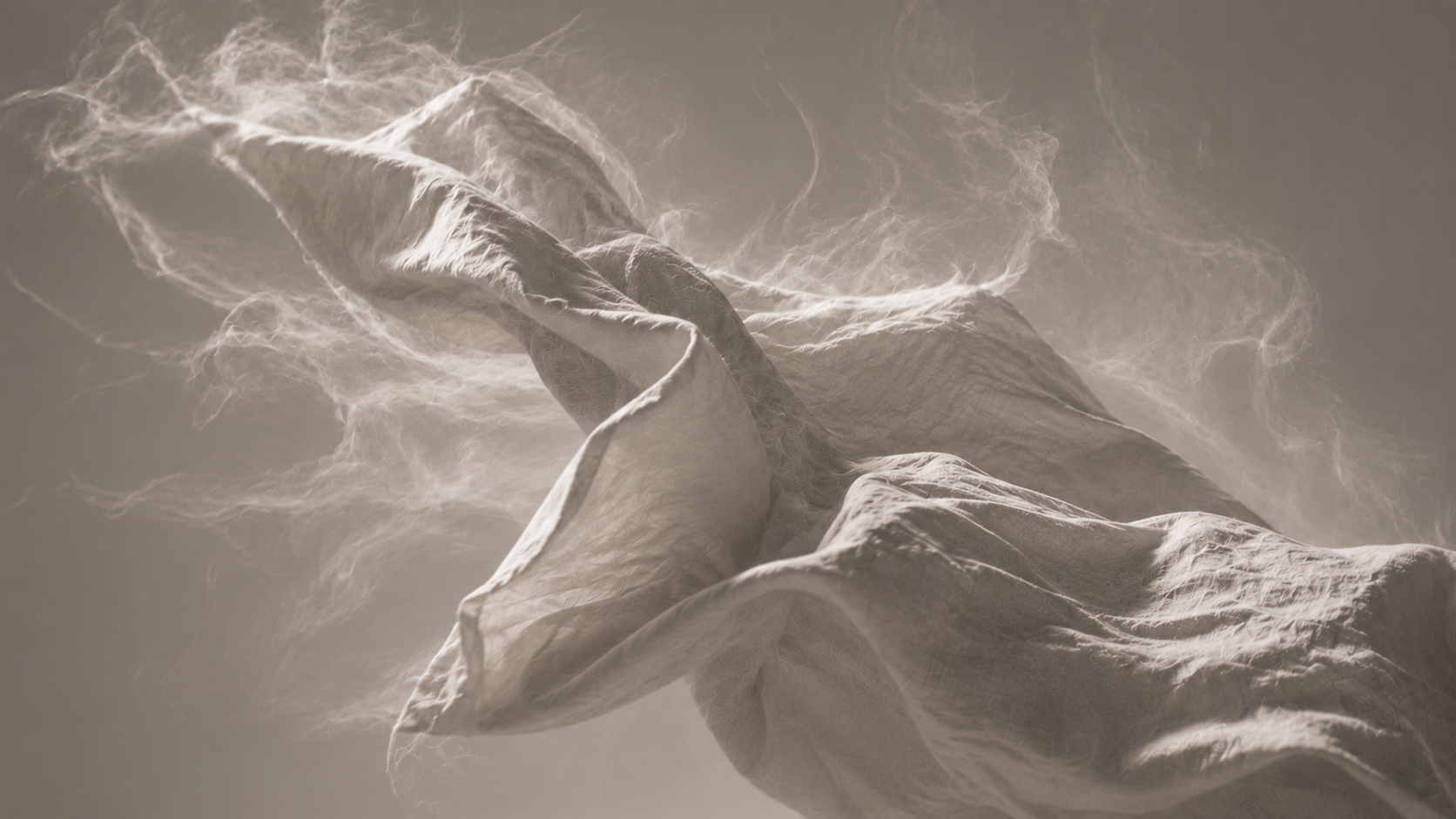 Close-up of flowing linen fabric in warm sepia tones with soft wisps suggesting scent trails in motion — abstract fine fragrance atmosphere for Senyumm laundry sheets.