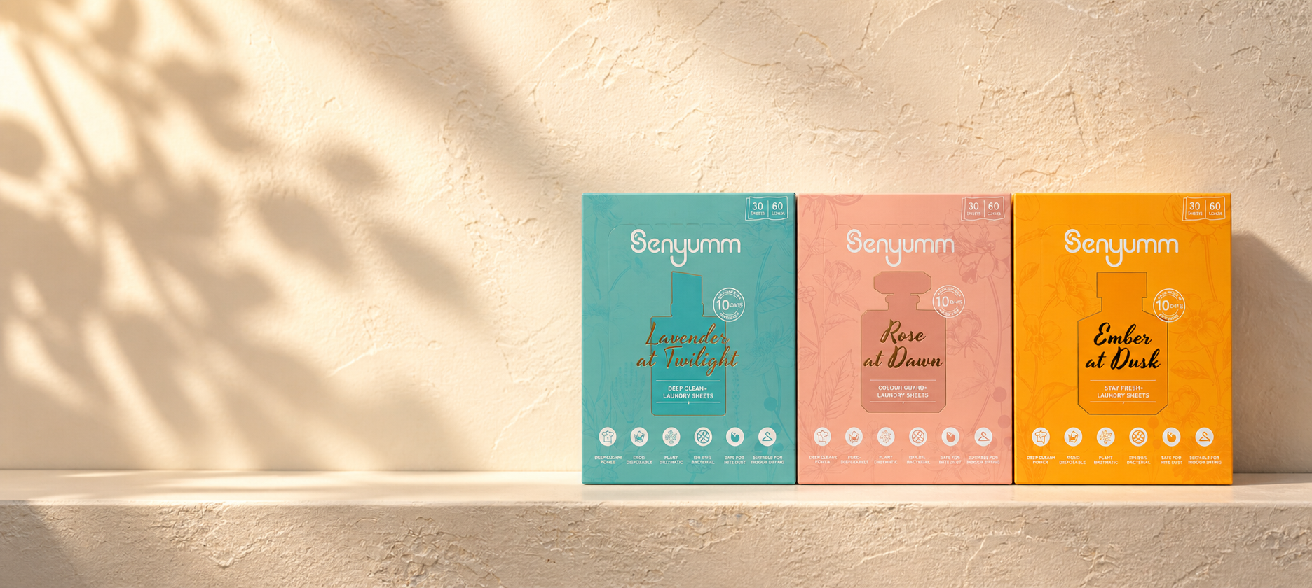 Senyumm laundry detergent sheets in three scents displayed on a minimalist shelf with soft natural light and neutral background.